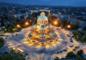 Aerial night view of Alexander Nevsky Cathedral in Sofia, Bulgaria, illuminated amid the city skyline